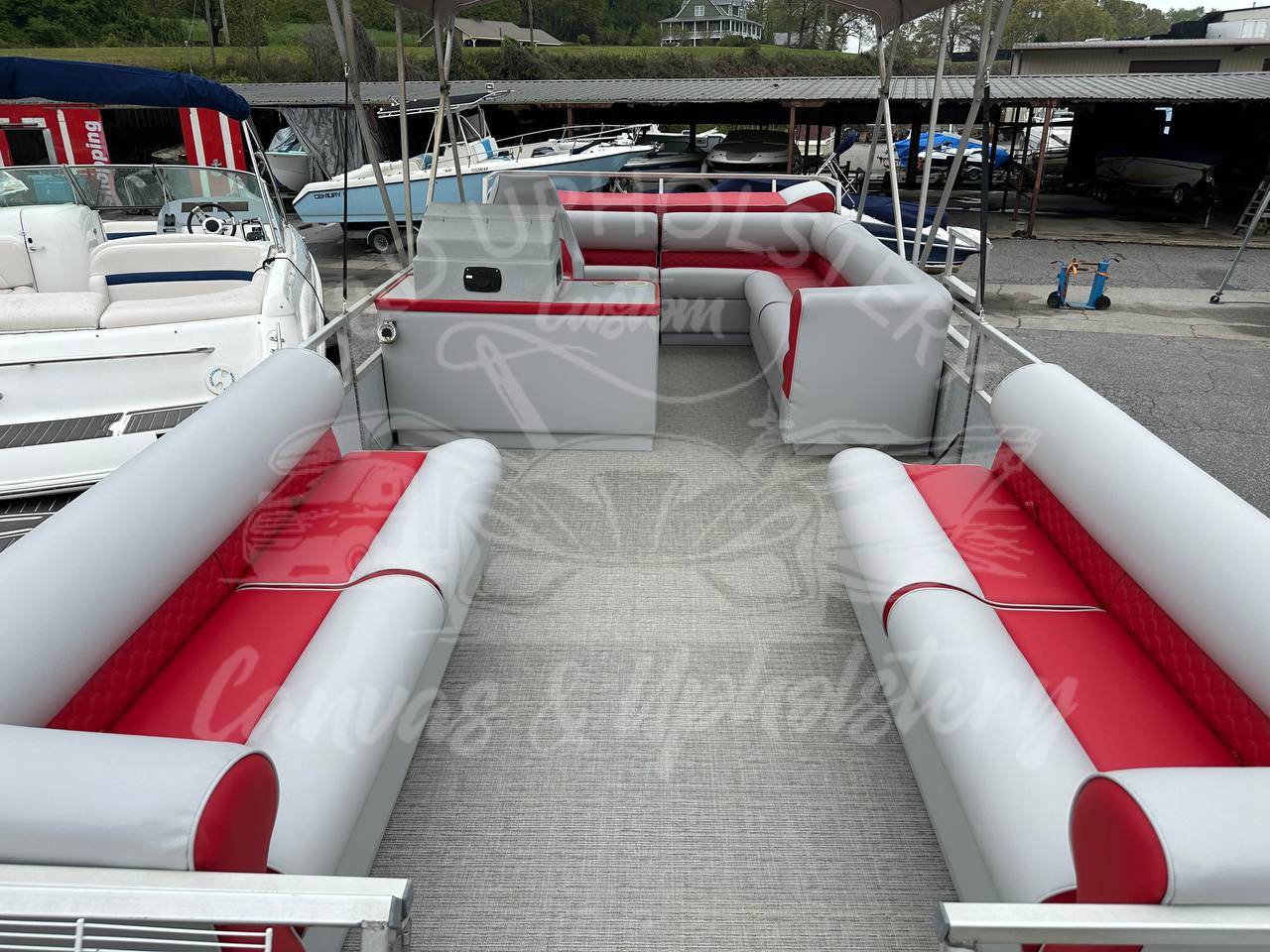 Full Custom Reupholstery with Hexagon Design for the Red Pontoon Crest